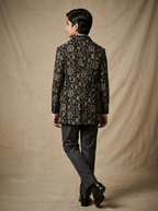 Boy wearing midnight black hand block printed celestial cotton shacket back view