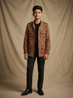 Boy wearing brown beige geometric hand block printed cotton shacket with mandarin collar front view