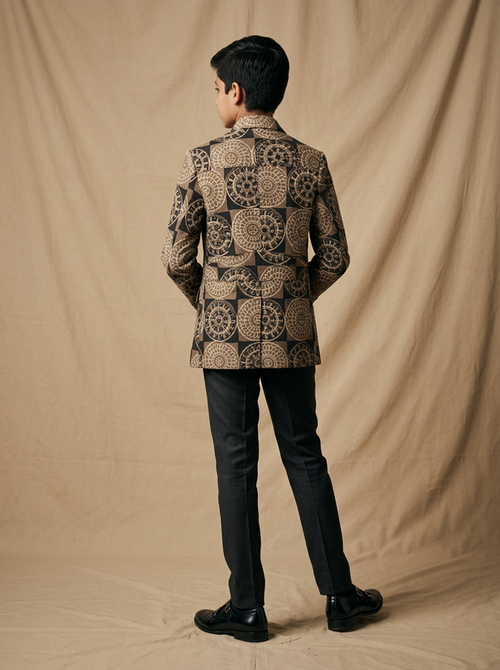 Boy wearing black beige medallion hand block printed cotton shacket back view