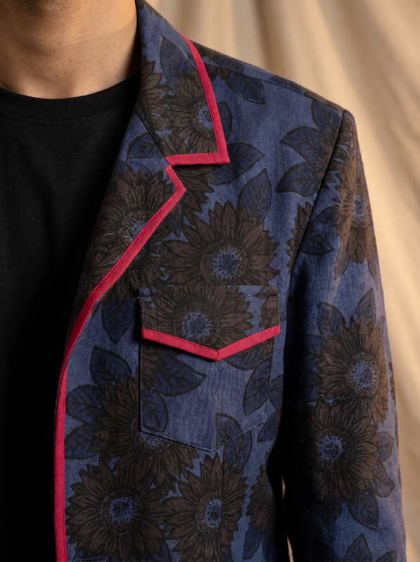 Boys navy blue sunflower shacket — close-up of dark print and red piping detail on collar and pocket
