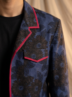 Boys navy blue sunflower shacket — close-up of dark print and red piping detail on collar and pocket