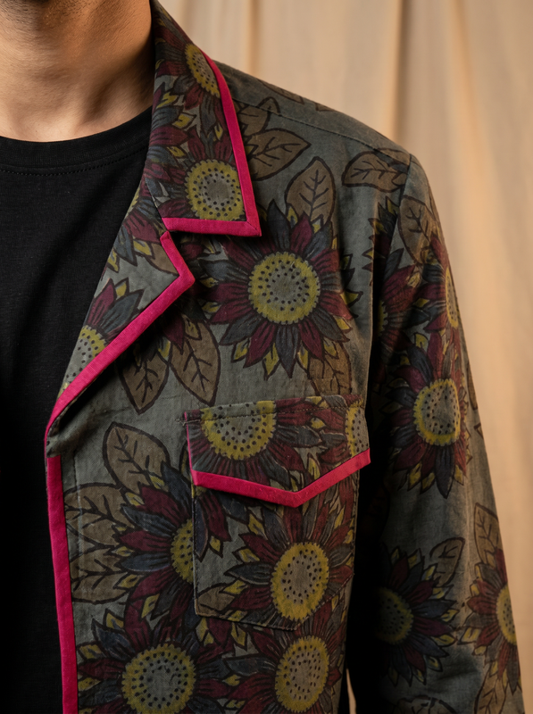 Boys olive grey sunflower shacket — close-up of dark botanical print and pink piping detail