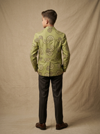 Boy wearing sage green hand block printed tribal spiral cotton shacket back view