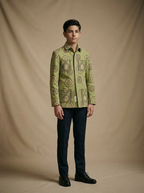 Boy wearing sage green hand block printed tribal spiral cotton shacket front view