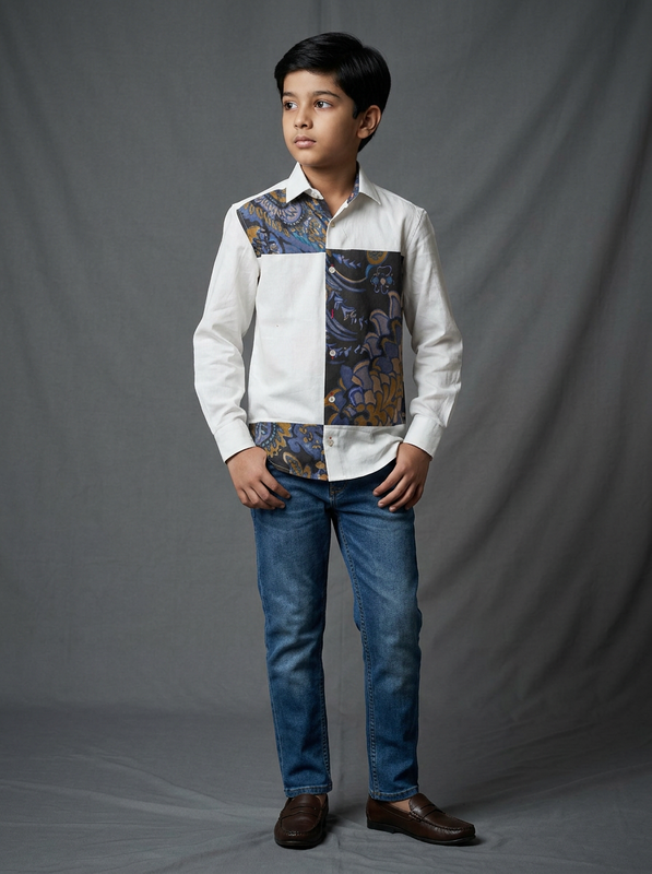 Boy wearing white cotton shirt with dark blue and mustard paisley floral printed contrast panel front view