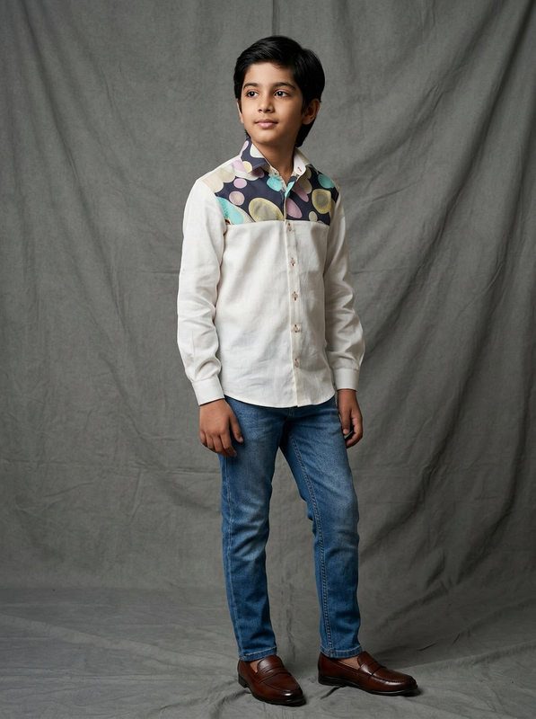 Boy wearing white cotton shirt with navy and multicolour circle dot printed yoke panel front view