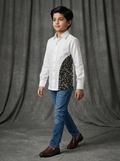 Boy wearing white cotton shirt with black abstract doodle curved side panel front view