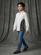 Boy wearing white cotton shirt with black abstract doodle curved side panel front view