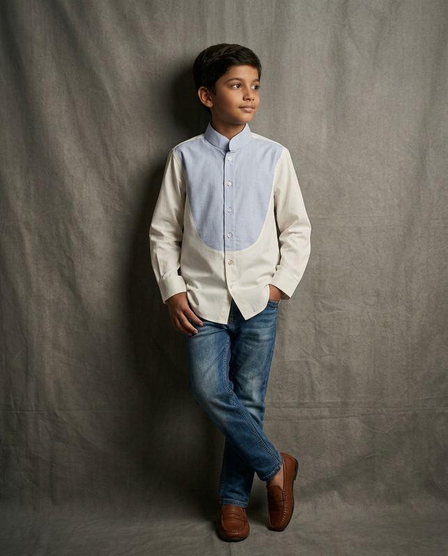 Boy wearing white cotton shirt with contrast blue bib panel and mandarin collar front view