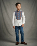 Boy wearing white cotton shirt with contrast blue brown tartan plaid bib panel and mandarin collar front view