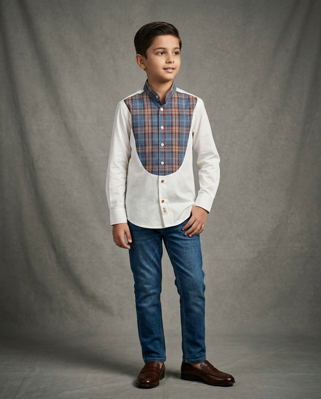 Boy wearing white cotton shirt with contrast blue brown tartan plaid bib panel and mandarin collar front view