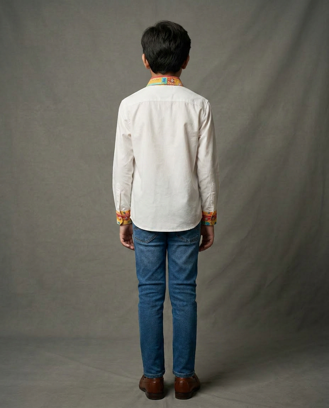 Boy wearing white cotton shirt with contrast mustard floral printed collar and cuffs back view