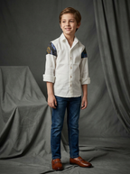 Boy wearing white cotton shirt with blue and gold abstract painted shoulder and sleeve panel front view