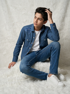 Boy wearing steel blue cotton casual shirt jacket with tonal crown embroidery and silver snap buttons front view