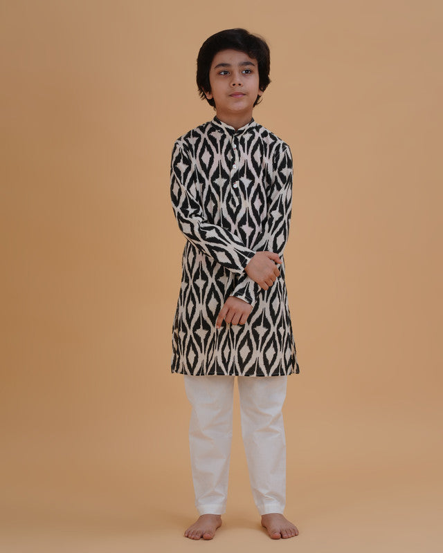 Boy wearing black & white boys black white ikat style print cotton kurta pajama set front view | NEW AGE CLOTHING