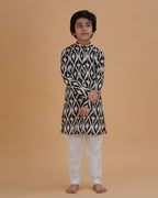 Boy wearing black & white boys black white ikat style print cotton kurta pajama set front view | NEW AGE CLOTHING